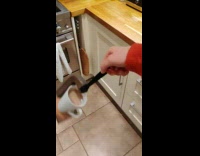 Guy swings around mug with tea inside 