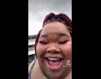 Lady is at beach because shes outside 