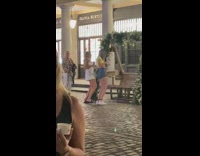 Mom watch two girls dance bench flowers