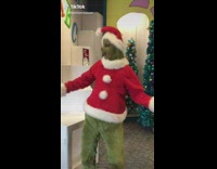 Dr Seuss christmas grinch at Universal Studios talking to girl