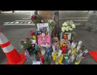 Woman dance near message for deceased street