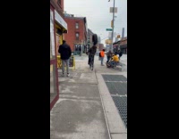 Guy rides bicycle balance tire on head