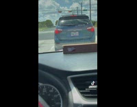 Car with sticker that says honk for a tbh delivers 