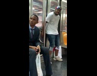 Guy flag bandana slaps door, makes beat and sings to beat on subway train
