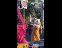Woman in mask floral dress park dance