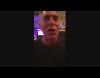 Man takes a shot of vodka, drops his lime wedge and catches it with his glass of beer