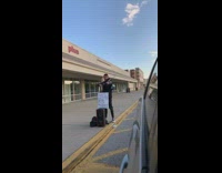 Woman green shirt selfie video with violin performer