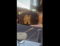 Collab WINY - Huge sculpture head transported by men on street 