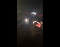 Woman parked beside scary car with scary decorations