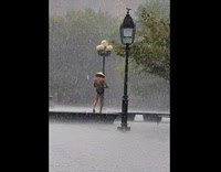 Guy with straw hat under the rain