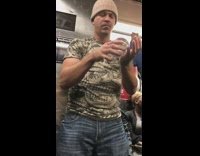 Guy skull shirt plays with crystal clear glass ball on subway train