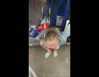 Little girl falls back pulling toilet plunger 