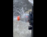 DIY bottle sprinkler attached at fire hydrant