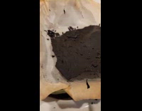 Woman shows failed attempt of baking brownies