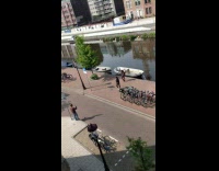 Two woman black jacket tiktok dance video shoot riverside