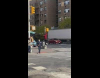 Guy does pushups at streetlight
