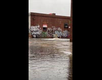 Collab WINY - Manhole on street overflows with flood water