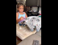 Girls play with star wars millennium falcon