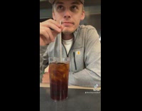 Guy accidentally knocks over his soda cup 