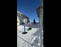 Guy does trick shot with toy hoops 