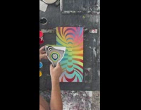 Artist pour psychedelic paint on dustpan abstract art