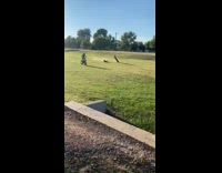 Guy on motorcross bike falls over when he attempts a wheelie