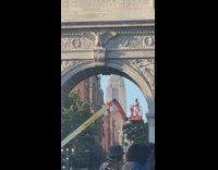 Man climbs on crane in park in front of girl taking graduation photos Part 2