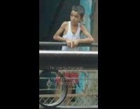 Boy stands outside on balcony and meows 