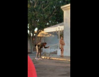 Girl black heels yellow curb white building 