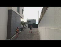 Two girls play tennis hit phone driveway