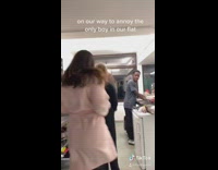 Four girls dance hop towards guy dishes