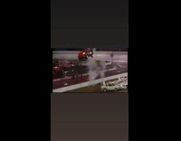 Red car tries to jump over cars