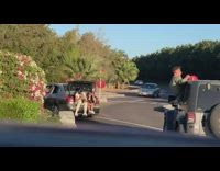 Two people car window dance trunk videographer