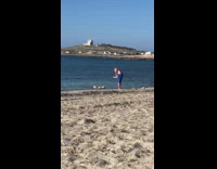 Woman lie down seaside photo shoot fail