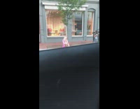 Blonde girl pink dress sit ground laugh