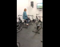 Teen tries bike pedal moves same time