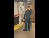 Collab Subway Creatures - Guy wears hazmat suit at subway station 