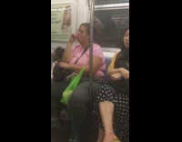 Pt. 2 Woman pink shirt sucks her thumb and takes away bag from little girl on subway train