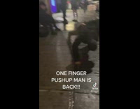 Guy does one finger pushup 