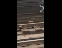 Abandoned baby doll on subway train tracks