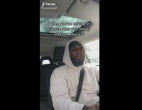 Guy white hoodie driving car