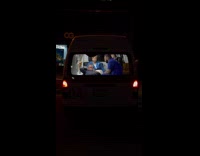 Paramedic and patient inside of Ambulance night