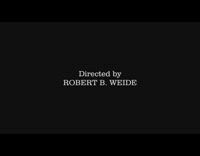 Guy on ski rail slides on back