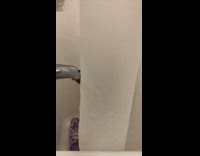 Cat lick water dripping from bathtub faucet