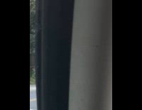 Guy wears blue jacket rides tall bike 