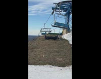 Woman falls off ski lift into dirt 