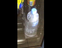 Malfunctioning vending machine spinning stuck water bottle 