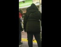 Guy carries elliptical exercise machine off subway train