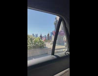 Blue dress lady tap dances patriotic statue 