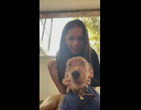 Girl has dog give camera kisses 